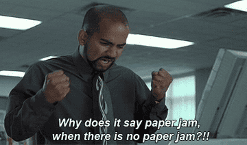 Office Space character getting frustrated with the printer