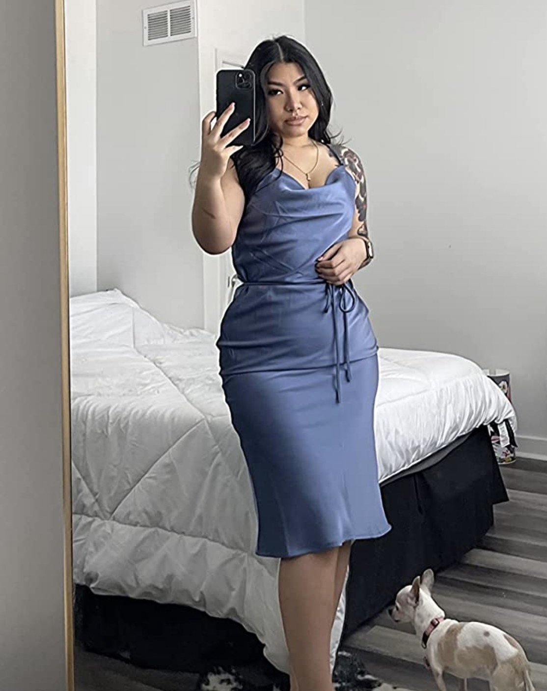 reviewer wearing the blue slip dress