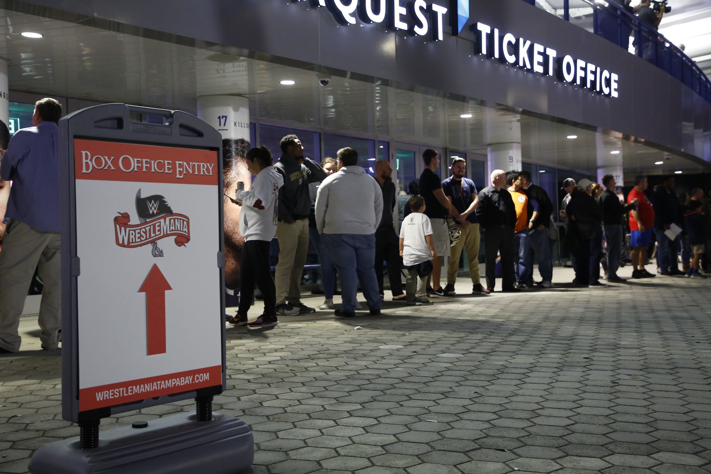 Hundreds of fans wait in line eager to purchase Wrestlemania 36 tickets a day before they go on sale to the general public at Amalie Arena in November 2019