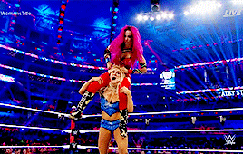 Becky Lynch dropkicks both Charlotte Flair and Sasha Banks at Wrestlemania 32