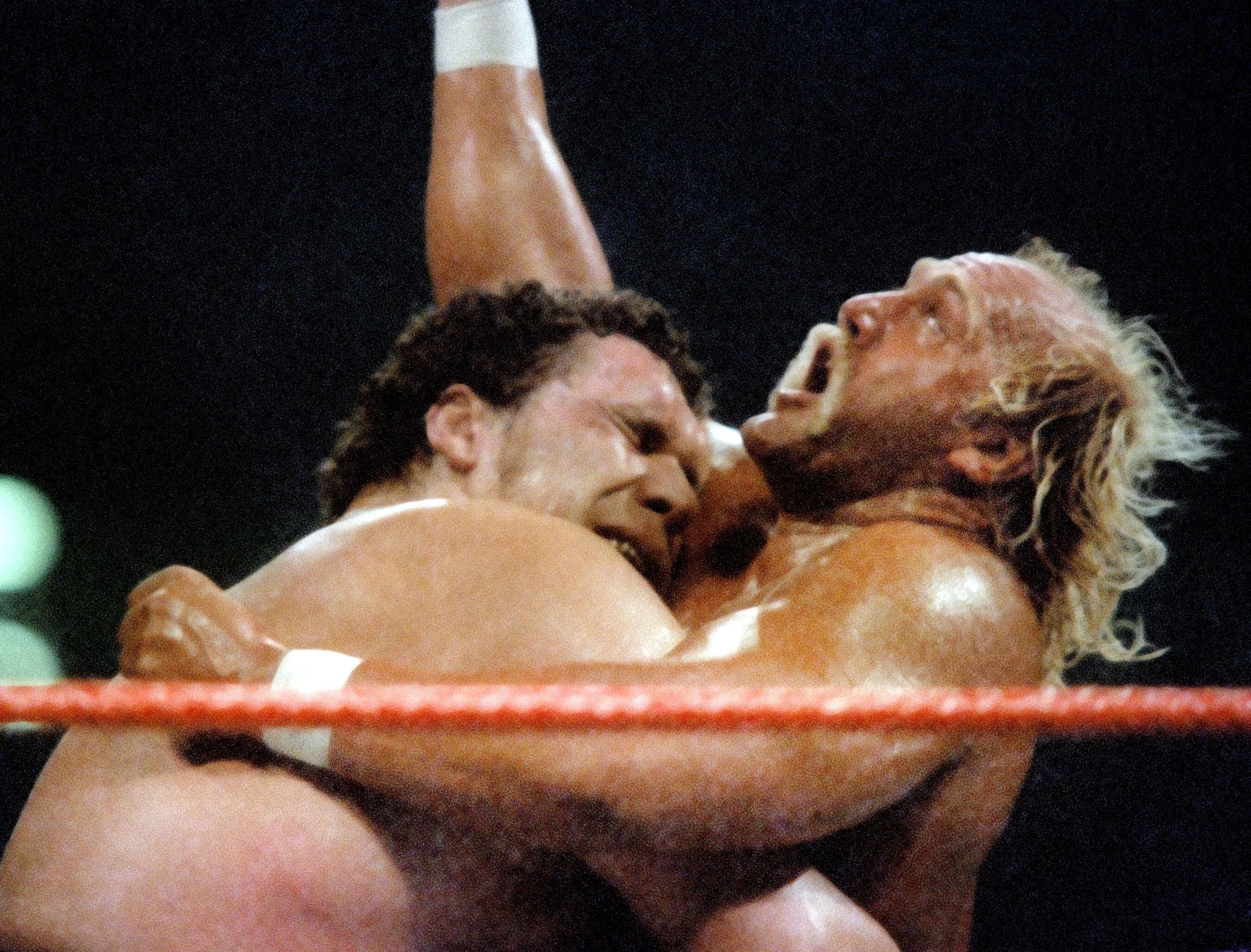 Andre the Giant bearhugs Hulk Hogan at Wrestlemania 3