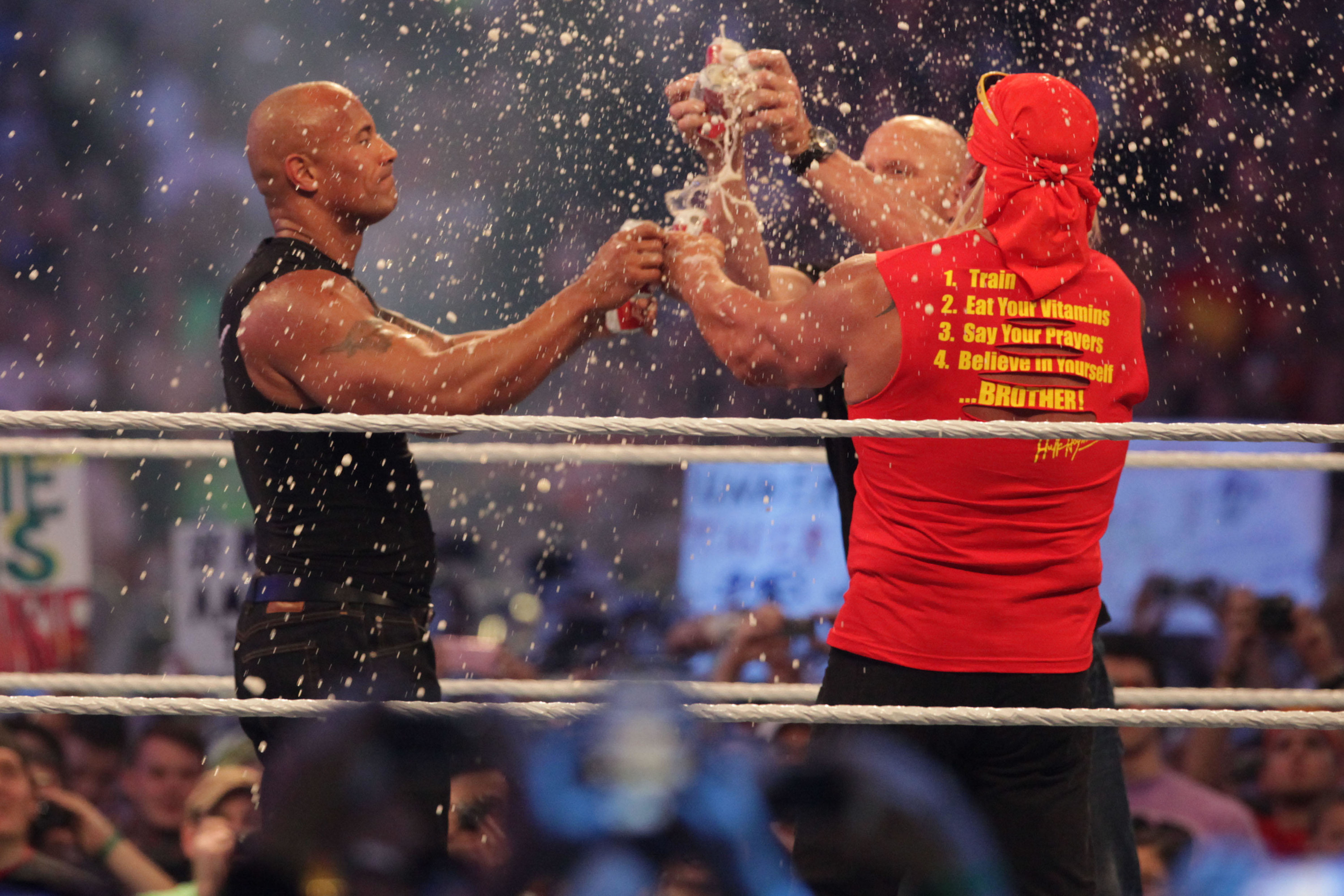The Rock, Steve Austin, and Hulk Hogan kicking off Wrestlemania 30 at the Super Dome