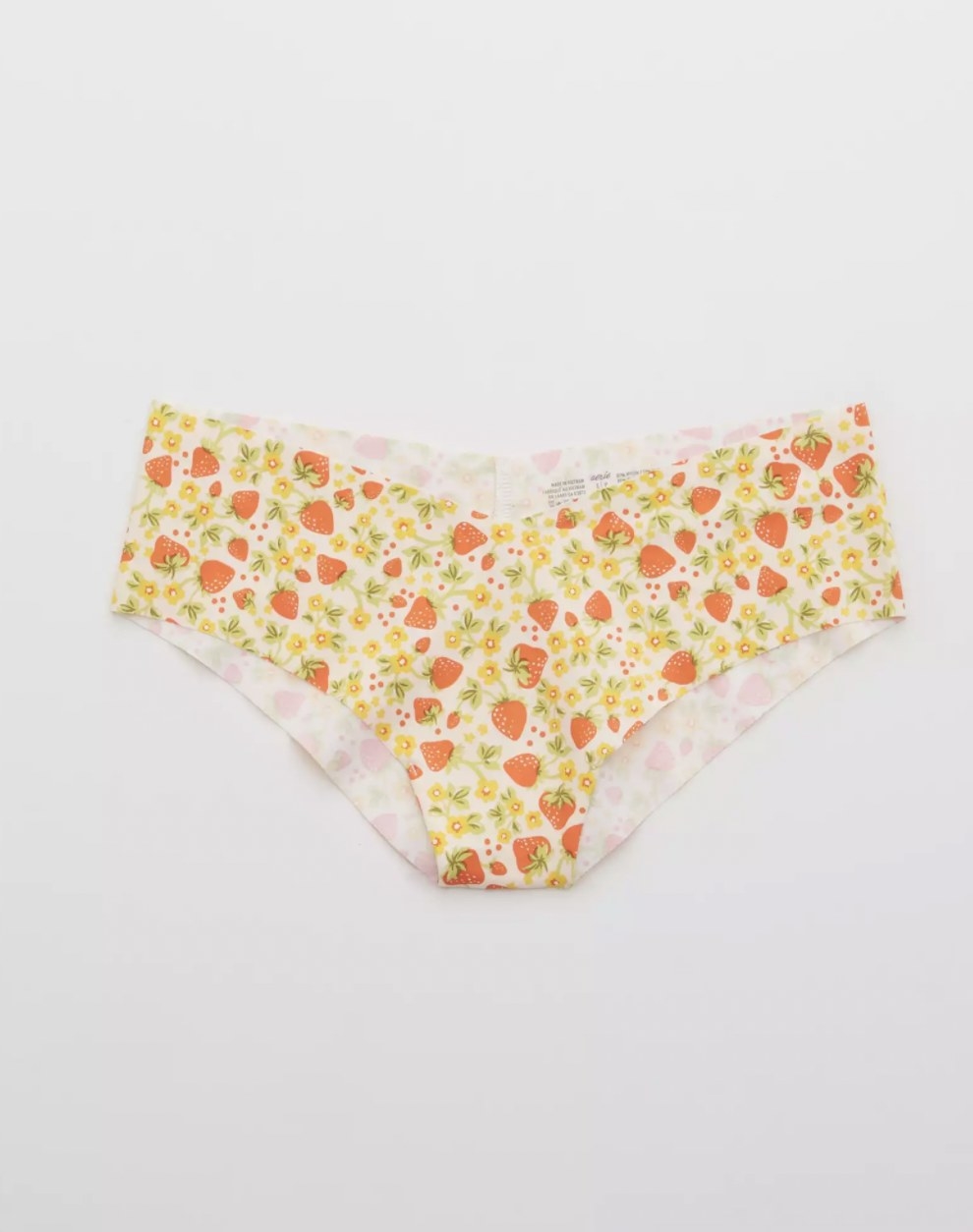 The cheeky thong with raw edges in floral and strawberry print pattern
