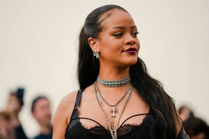 Rihanna, who&#x27;s wearing multiple necklaces, looking off to the side