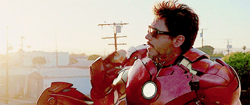 GIF of Tony Stark in Iron Man suit eating a donut