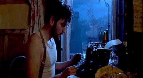 Ewan McGregor as Christian typing on a typewriter