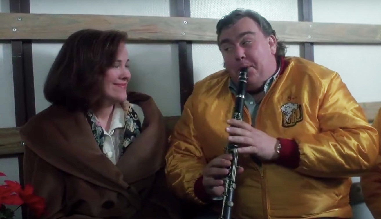 Kate listens to John Candy playing the clarinet