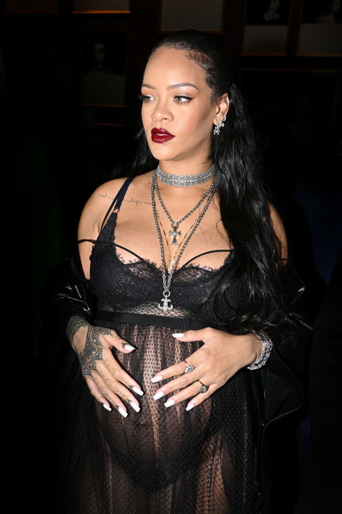 Rihanna cradling her lingerie-clad baby bump