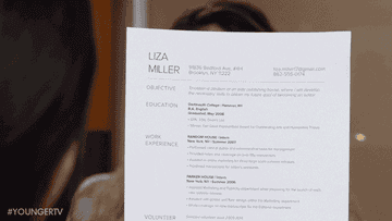 Character smiling behind her resumé in a job interview