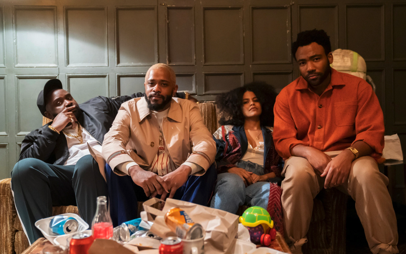 Four members of the Atlanta cast, including LaKeith Stanfield and Donald Glover, sitting on a couch close together