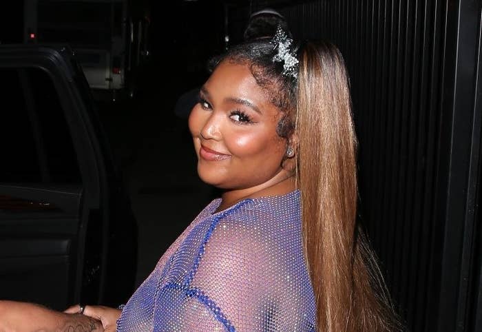 Lizzo smiling for the cameras