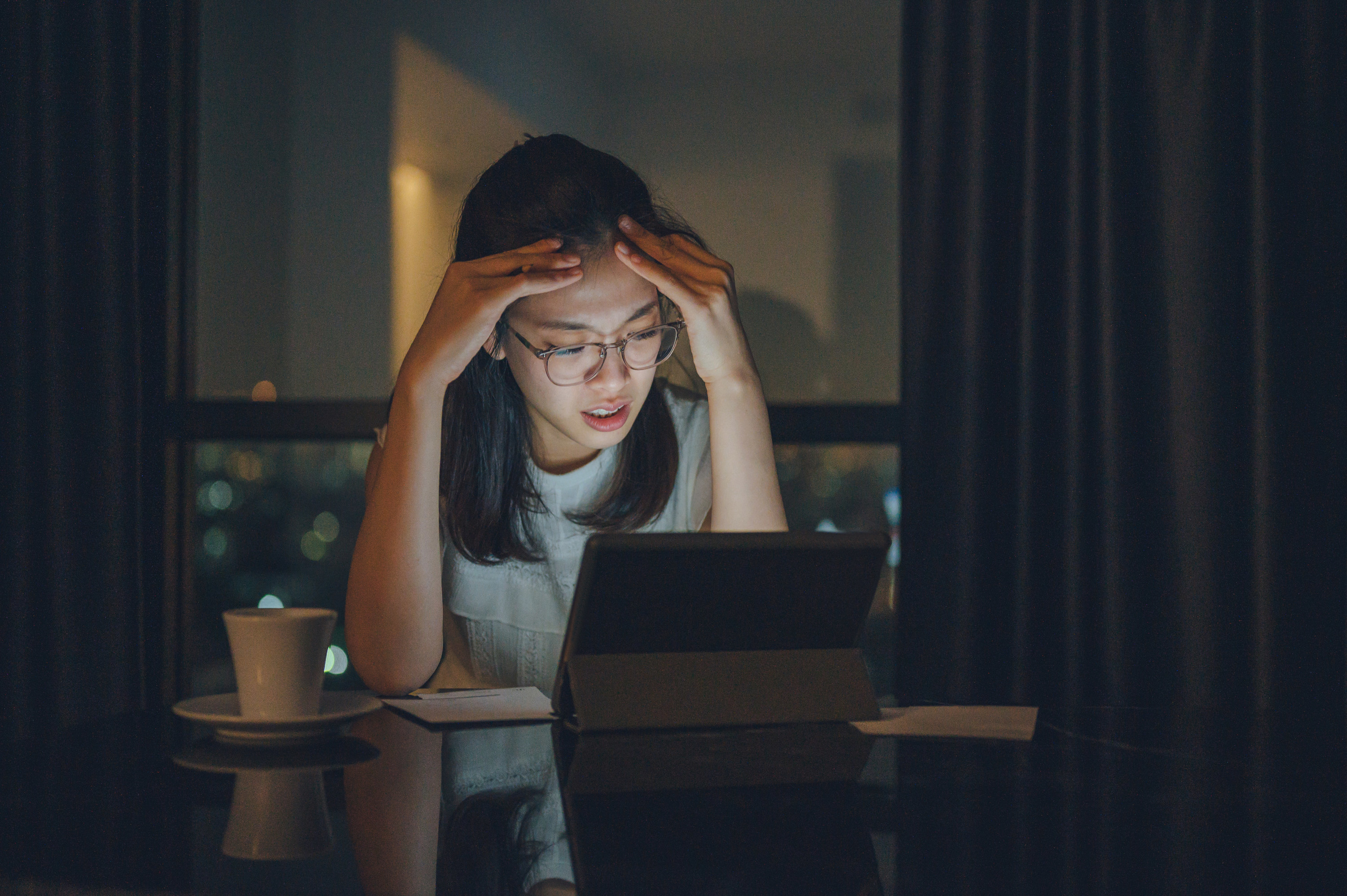 Stressed out woman working late at home