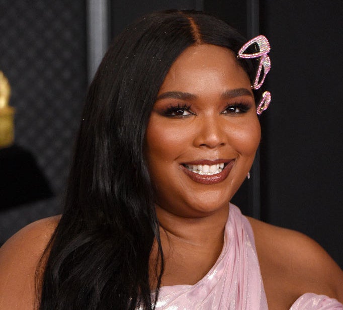 Lizzo smiling on the red carpet