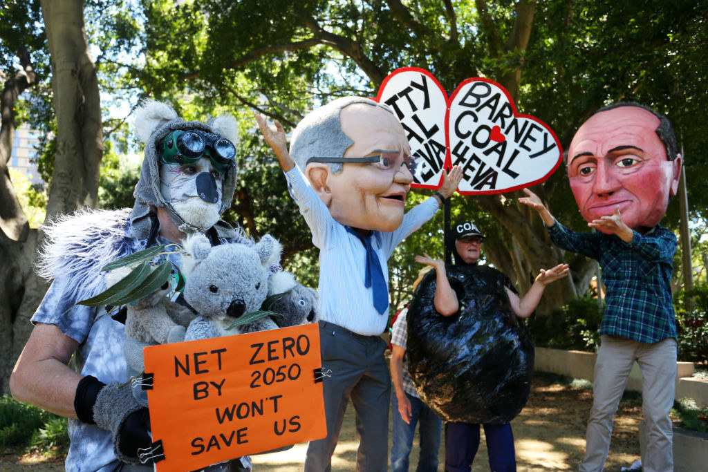 climate activists dressed as a koala, Prime Minister Scott Morrison and Barnaby Joyce at a protest