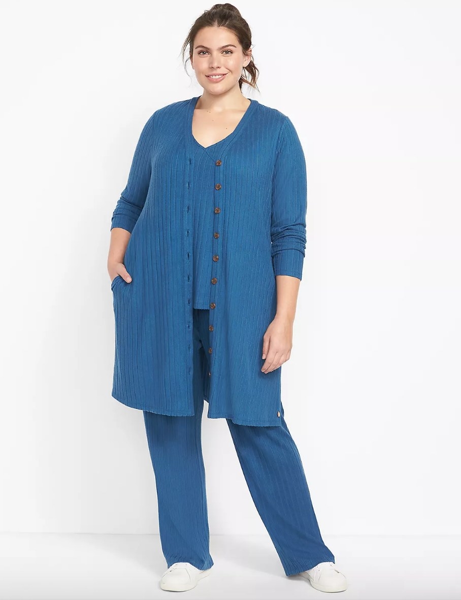 Model wearing blue cardigan over matching shirt and pants
