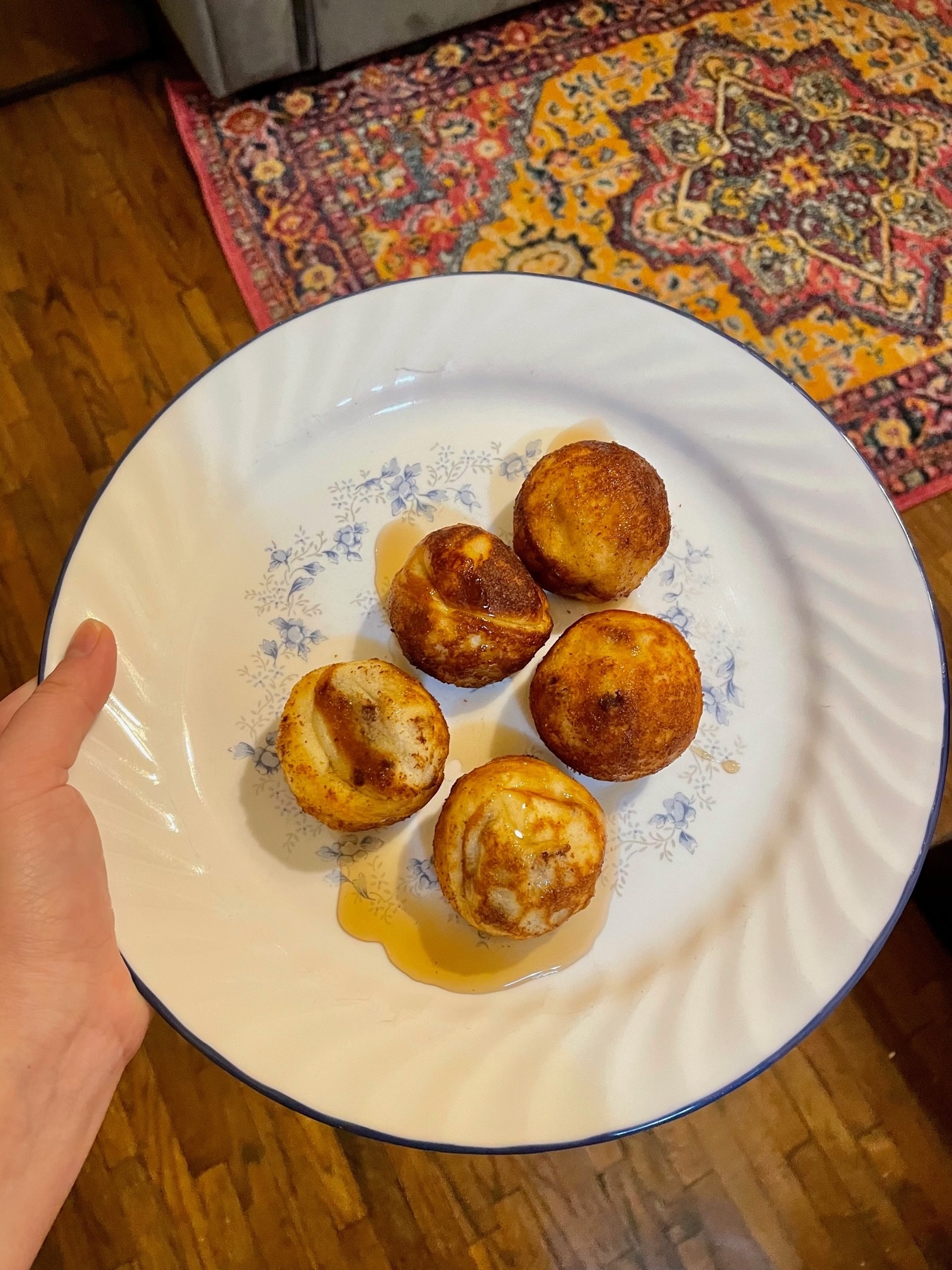 plate of pancake bites with a little syrup