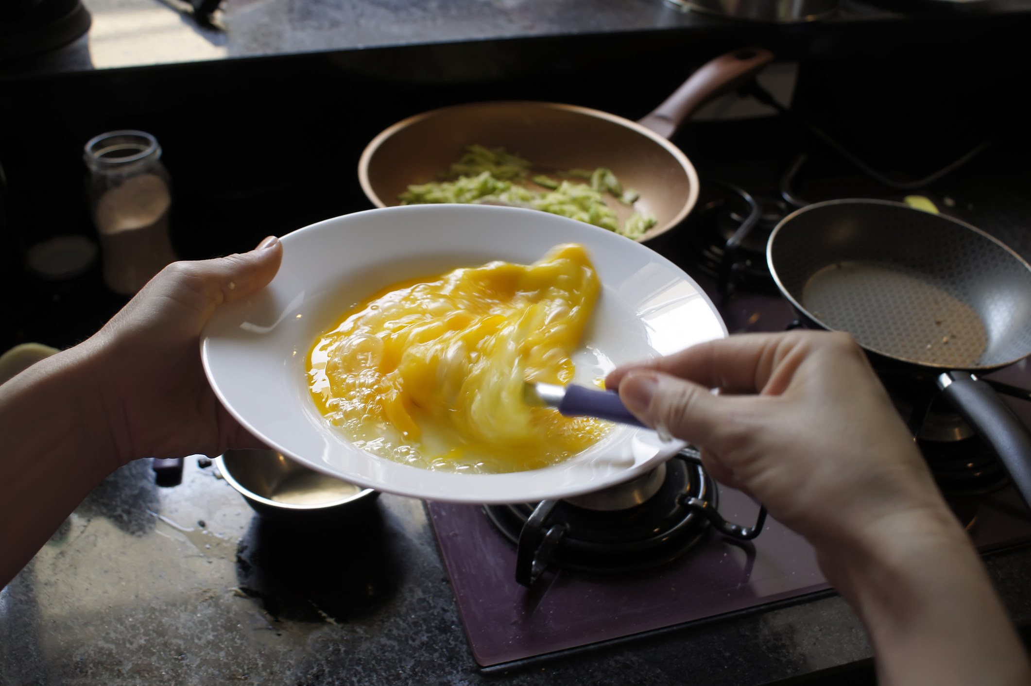 Preparing an omelet with zucchini