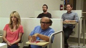 Gif of four older people in a classroom looking confused