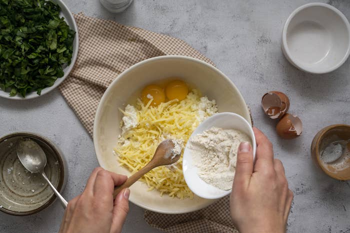 Combining ingredients in a bowl for quiche