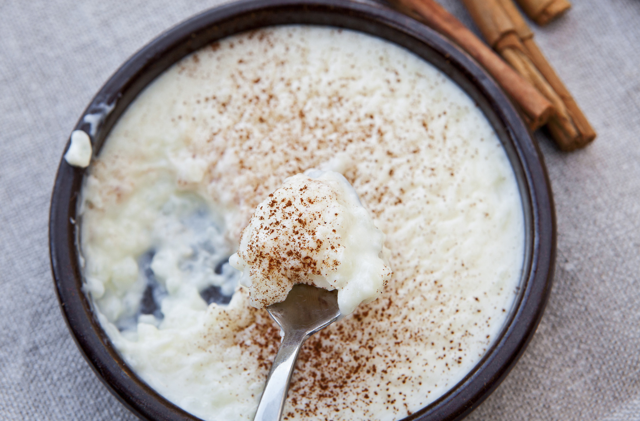 A bowl of rice pudding with cinnamon