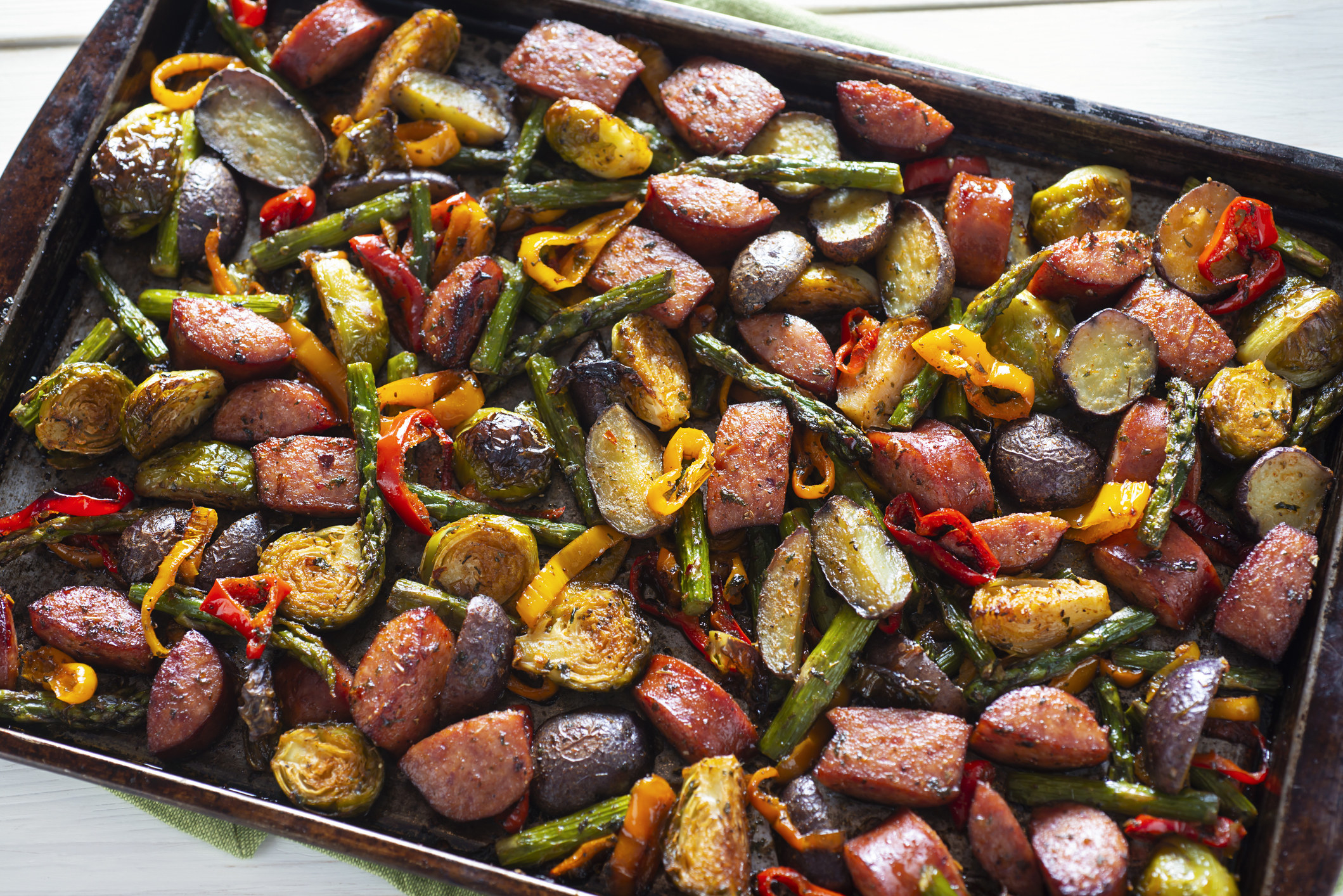 A bunch of roasted vegetables on a baking sheet