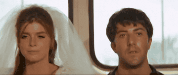 Benjamin and Elaine sitting on a bus together in &quot;The Graduate&quot;