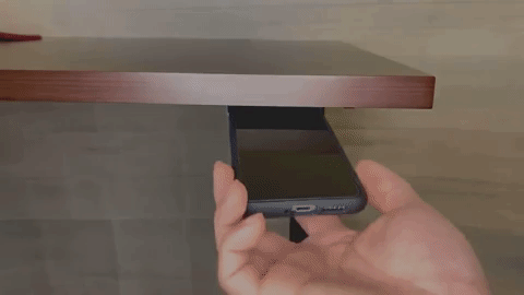 a gif of a person removing a phone from the holder