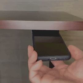 a gif of a person removing a phone from the holder