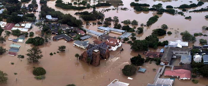 A view of Lismore captured from the flood line; it shows houses being submerged under flood waters