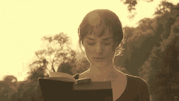 Elizabeth Bennet walking while reading a book
