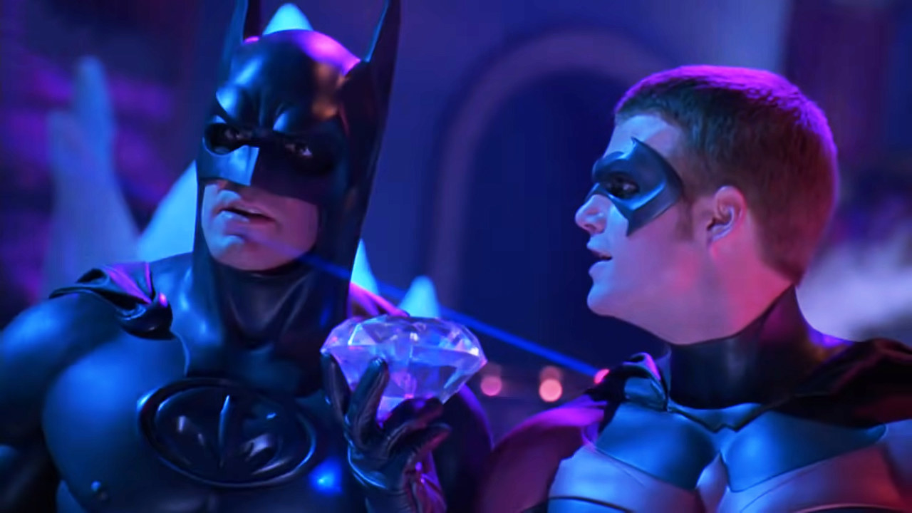 George Clooney as Batman and Chris O&#x27;Donnell as Robin hold an enormous diamond