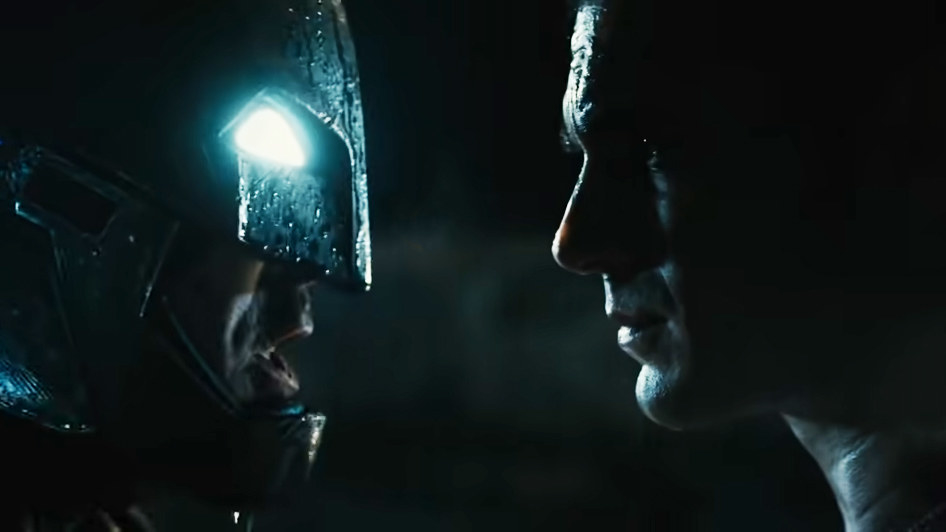 Ben Affleck as Batman in an armored suit faces off with Henry Cavill as Superman