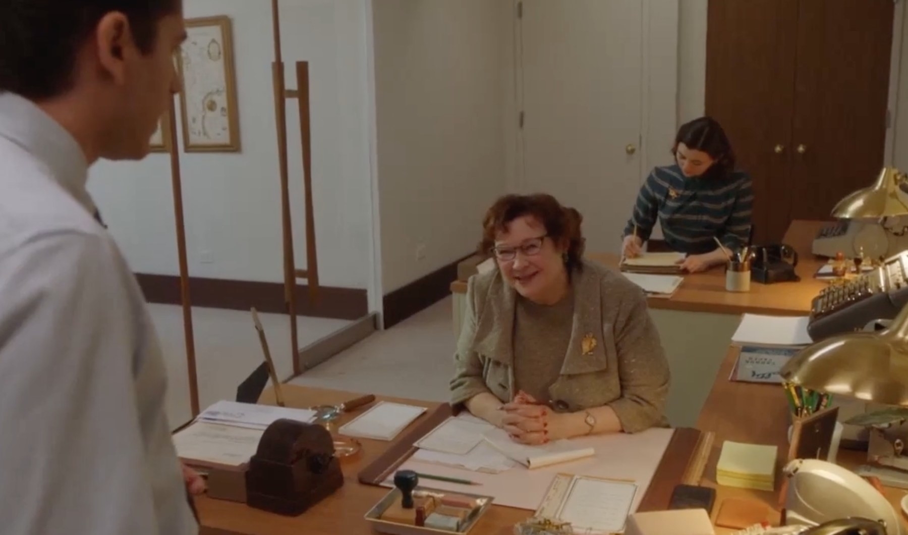 Mrs. Moscowitz at her desk in mrs. maisel