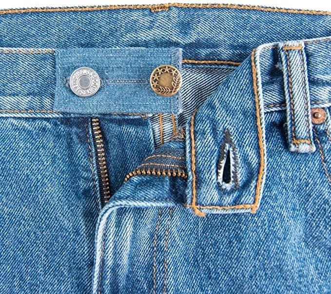 The waistband extender on a pair of jeans