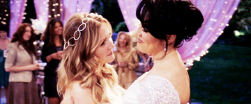 Sara Rodriguez as Cassie and Jessica Capshaw as Arizona dancing together on their wedding day in Grey&#x27;s Anatomy