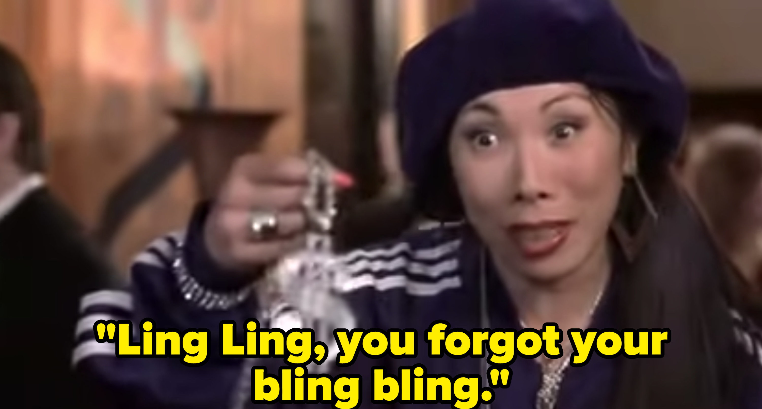 A close up of Ling Ling&#x27;s mom as she holds an oversized diamond chain