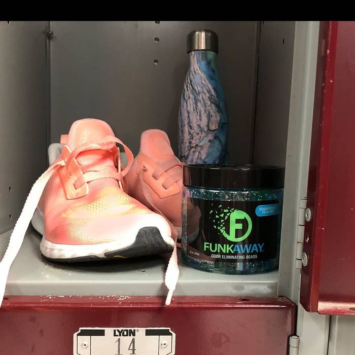 a jar of odour eliminating beads inside a gym locker