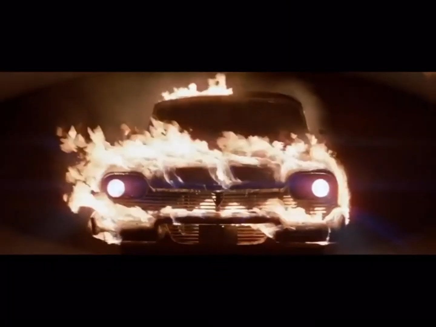 Christine driving while on fire in "Christine"