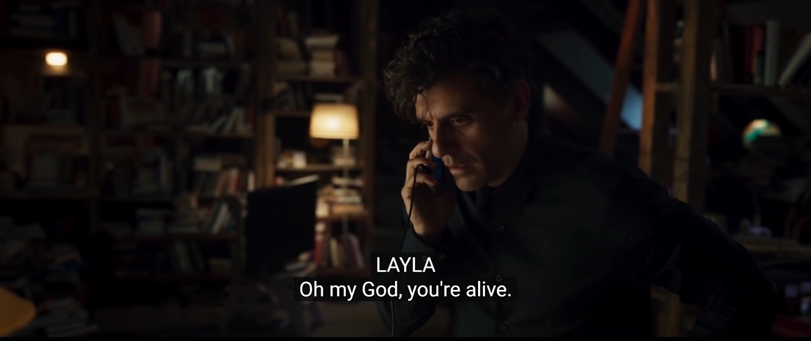 Marc on the phone, with a subtitle reading, &quot;Layla: Oh my god, you&#x27;re alive&quot;