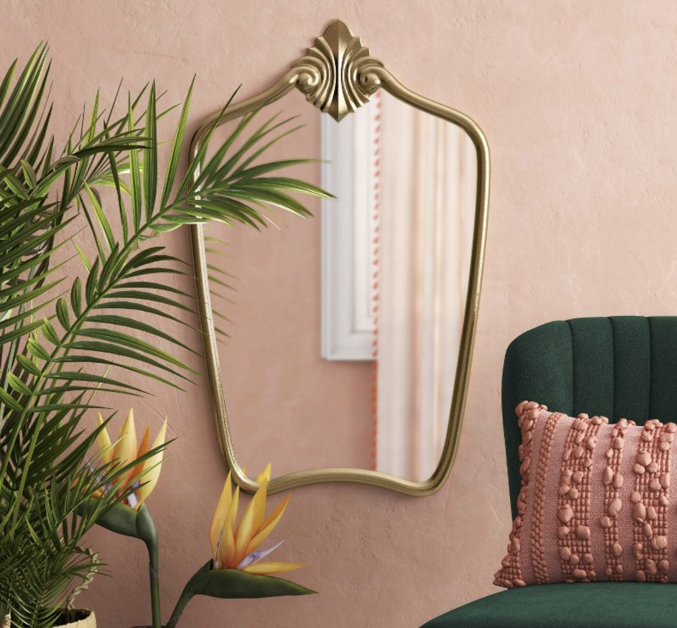 the ornate gold mirror on a wall