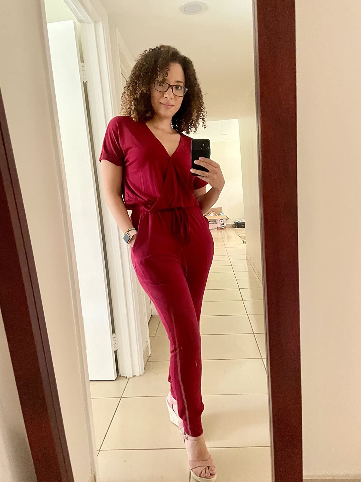 reviewer wearing jumpsuit