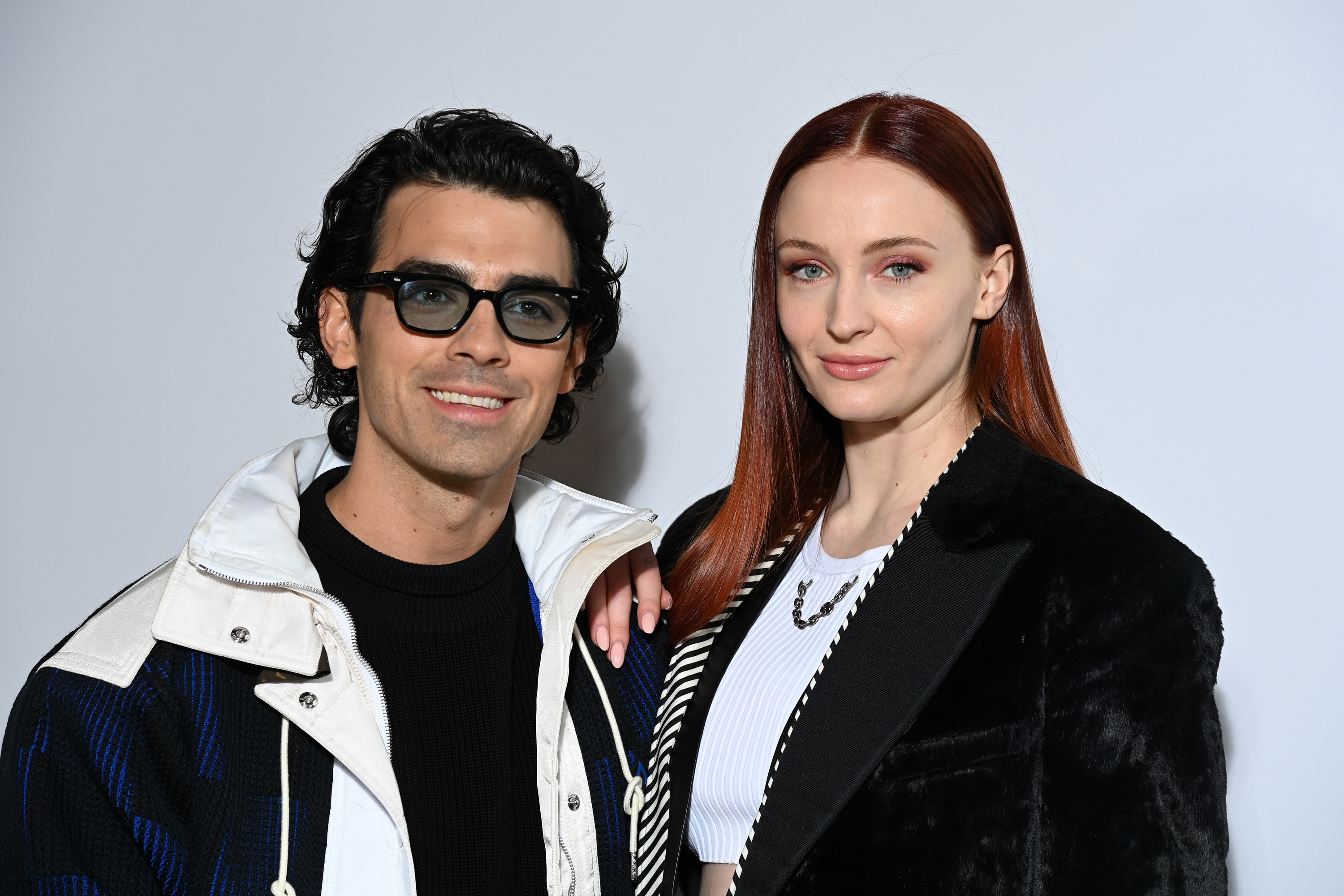 Joe Jonas and Sophie Turner smile as they appear at the Louis Vuitton Womenswear Fall/Winter 2022/2023 show at Paris Fashion Week in March 2022