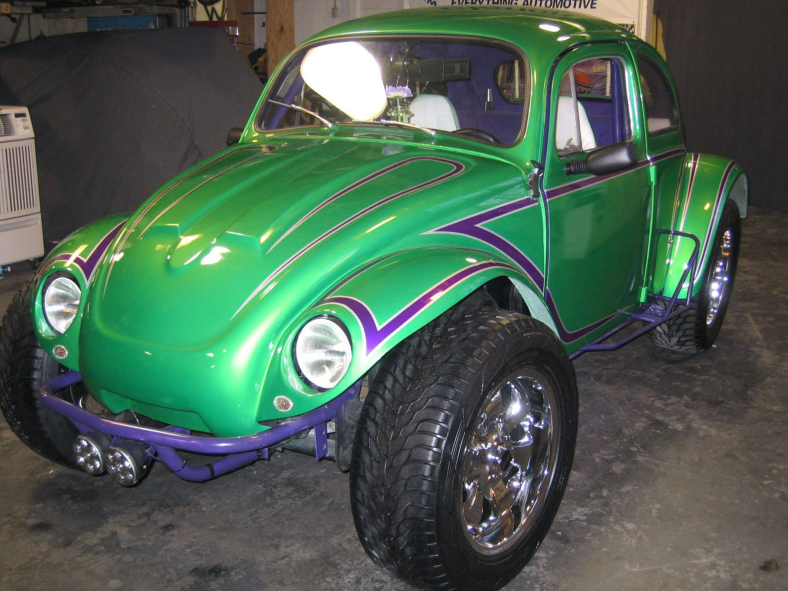 a green volkswagon beetle tricked out for the show