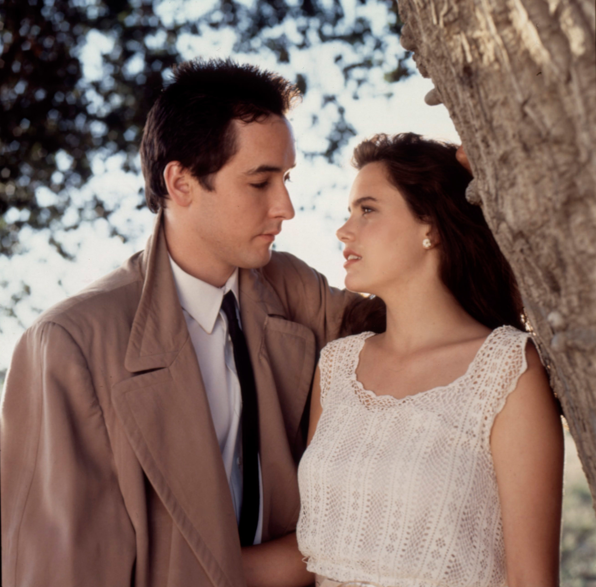 Diane and Lloyd in the outdoors looking at each other