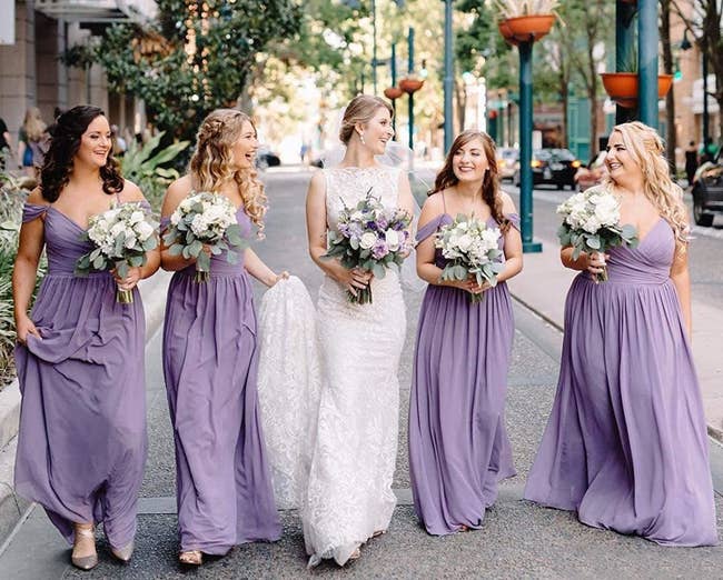 four bridesmaids in the lavender dress surrounding a bride