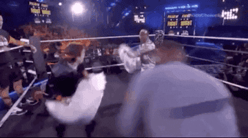 GIF of two people having a pillow fight with body pillows at the Kids&#x27; Choice Awards