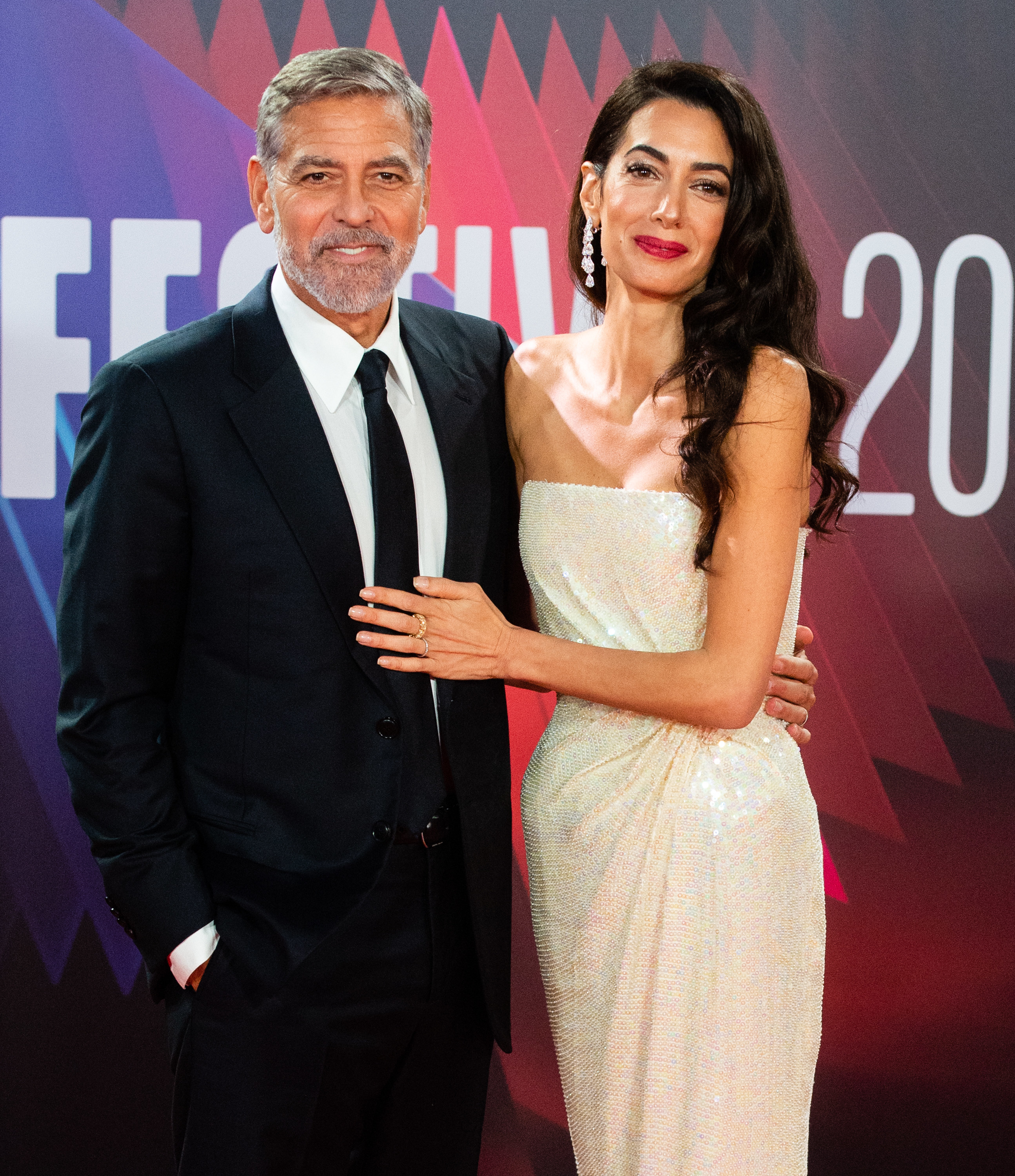 George and Amal pose at the &quot;Tender Bar&quot; premiere in 2021