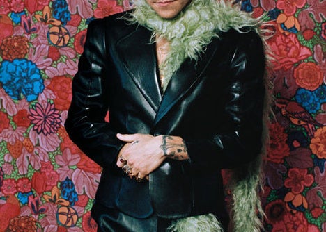 Harry Styles posing for an editorial photo shoot 