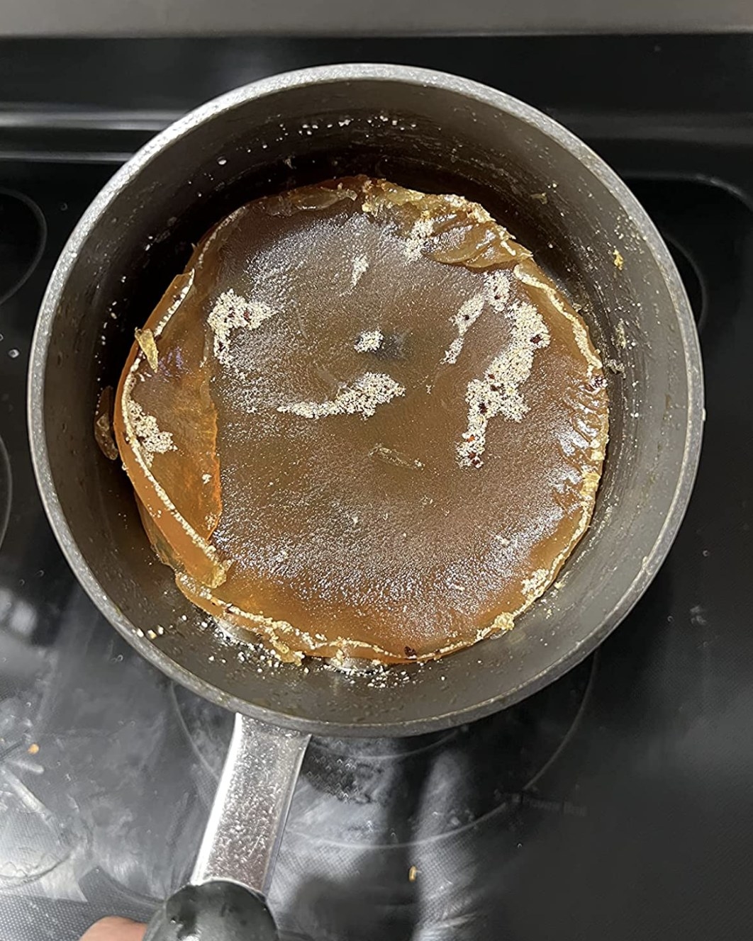 reviewer using the grease pan