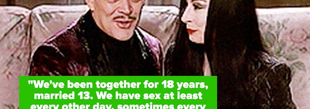 Gomez and Marticia sitting on the couch, holding each other's hands